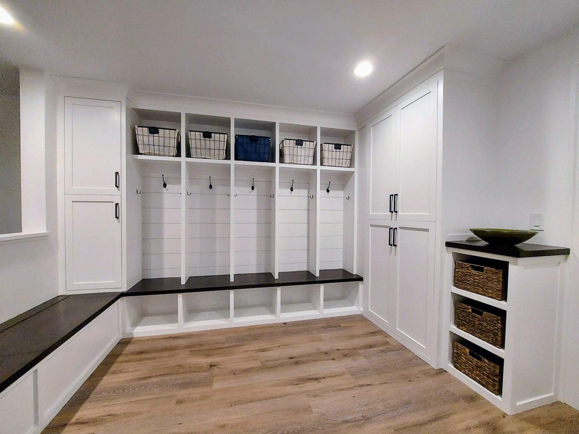 Mudroom lockers with bench seating and tall cabinets in a Ridgefield, CT home